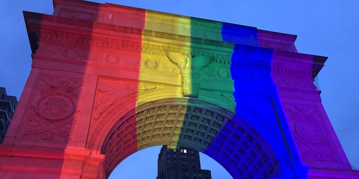 A rainbow projected on the arch in Washington Square, in New York City